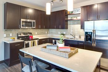 Gourmet kitchens with quartz countertops and islands